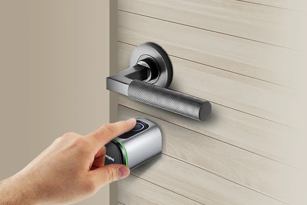 Opening the door with smart locks fingerprint scanner
